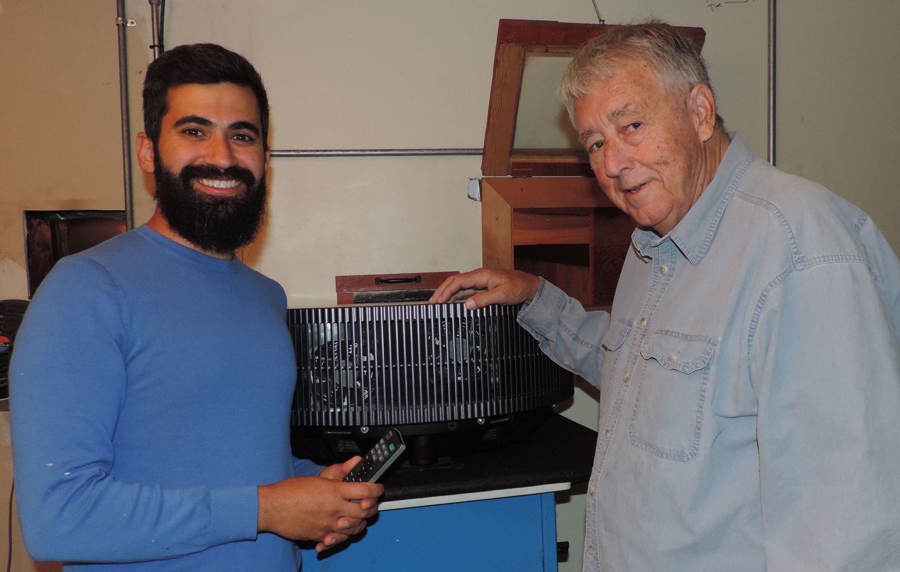 navied mahdavian and bob bagley look over new projector